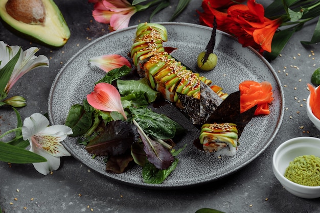A close-up shot of a beautifully plated dish featuring lab-grown seafood, such as sushi or grilled fish, alongside fresh vegetables and herbs. The setting is a modern, upscale restaurant.