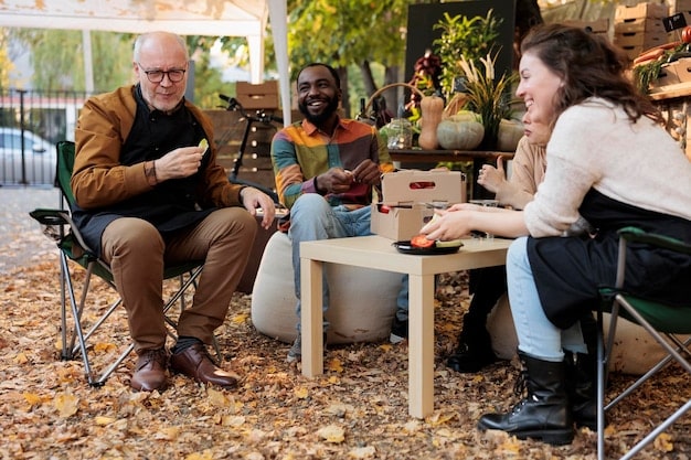A group of musicians networking at a music industry event, exchanging business cards and engaging in conversation.