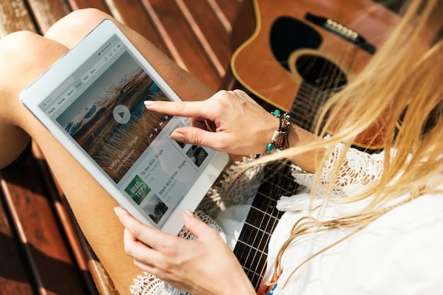 A close-up of a musician's hands using a tablet to review real-time data analytics for their music streaming performance. The tablet displays graphs and charts illustrating listener demographics, song popularity, and geographic reach.