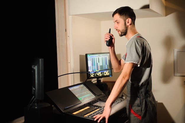 A musician setting up recording equipment in a home studio, including a microphone, audio interface, and computer with music production software. The room is well-lit and acoustically treated to enhance audio quality.