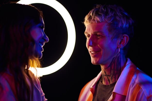A close-up shot of a musician making eye contact with an audience member, both smiling. The lighting highlights their expressions, emphasizing the connection.