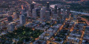 Aerial view of a US city skyline at dusk, illustrating remote work's impact on urban areas.